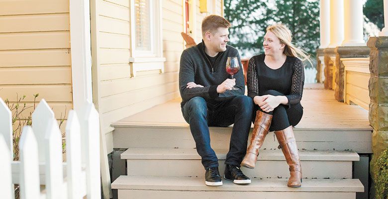 Bryan and Laura Laing, owners of Hazelfern Cellars in Newberg, relax on the porch of their old farmhouse located on the same property as their new winery. ##Photo provided.