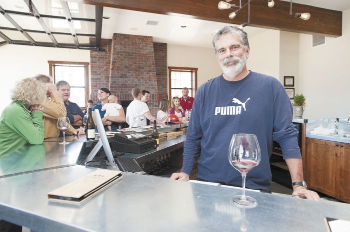 De Ponte Cellars owner Scott Baldwin welcomes guests to his new tasting room in downtown Carlton. Photo by Marcus Larson. De Ponte Cellars owner Scott Baldwin welcomes guests to his new tasting room in downtown Carlton. Photo by Marcus Larson.