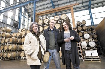 Partners Trish Rogers, national sales, Rob Stuart, general manager and winemaker, and Maria Stuart, direct sales and marketing, in the main fermentation room of R. Stuart & Co. in Mc-
Minnville’s Pinot Quarter. The facility has served as home base since 2002, the same year R. Stuart
launched its Big Fire label.