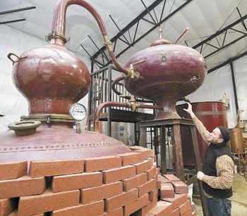 Ransom owner Tad Seestedt describes the distillation steps of his 300-gallon alembic pot still. The classic, all-copper device was manufactured in 1978 in Cognac, France. Ransom owner Tad Seestedt describes the distillation steps of his 300-gallon alembic pot still. The classic, all-copper device was manufactured in 1978 in Cognac, France.