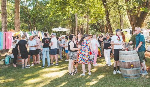 The crowd at this summer s Queer Wine Fest. The event raises money for Wine Country Pride, a Yamhill County-based nonprofit serving the queer and allied communities. ## Photo by Foundry 503