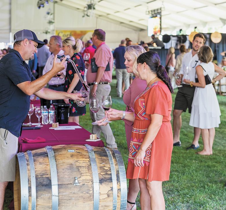 Event guests enjoyed samples of wine straight from the barrel.##Photo by Steven Addington Photography Event guests enjoyed samples of wine straight from the barrel.##Photo by Steven Addington Photography