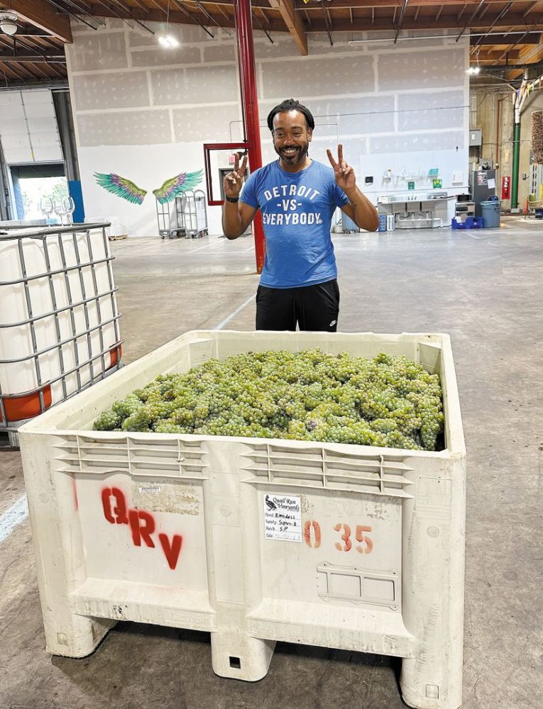 AVP incubator program’s Randall Coats, founder of Wine 4 The People, standing behind a bin of fresh wine grapes. ## Photo provided by AVP Wine Collective AVP incubator program’s Randall Coats, founder of Wine 4 The People, standing behind a bin of fresh wine grapes. ## Photo provided by AVP Wine Collective