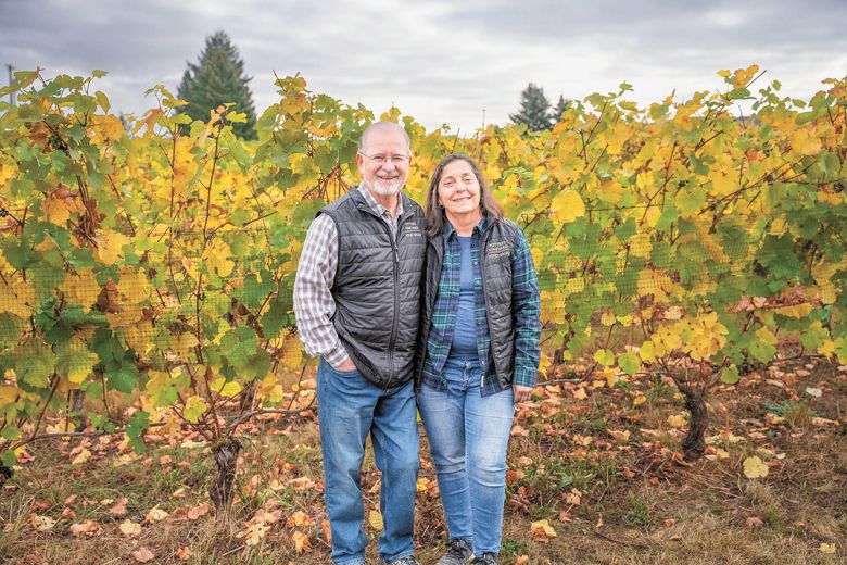 Owners Bill and Sandy Sanchez standing in their Chehalem Mountains Potter s Vineyard.##Photo courtesy of Potter’s Vineyard & Vino Vasai WinES
