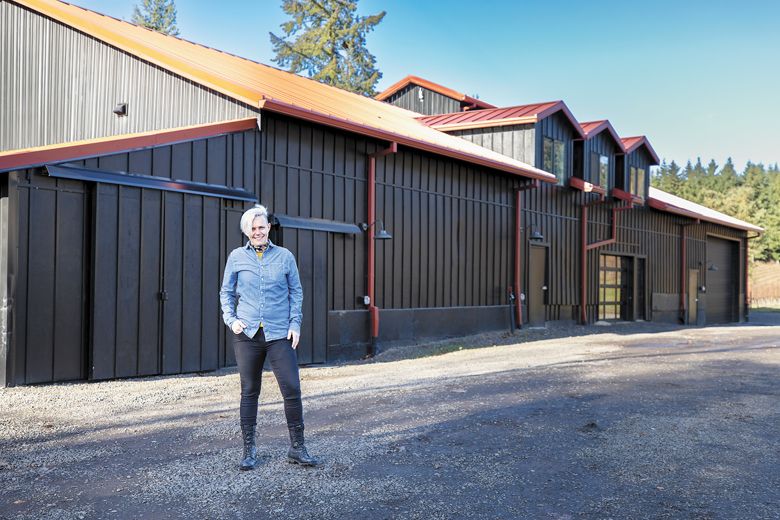 Remy Drabkin posing in front of her Dundee Hills winery. ##Photo by Nick Hoogendam