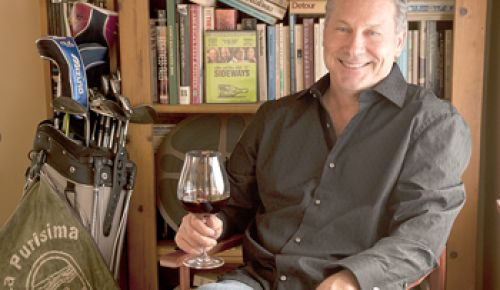 Rex Pickett, author of “Sideways” and it’s new sequel, “Vertical,” relaxes with a glass of Oregon Pinot Noir in his home in Santa Monica, Calif.