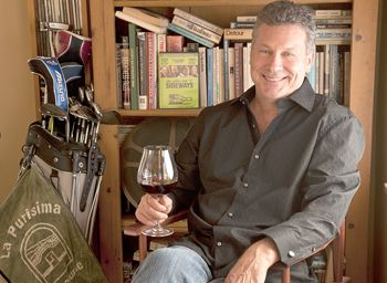 Rex Pickett, author of “Sideways” and it’s new sequel, “Vertical,” relaxes with a glass of Oregon Pinot Noir in his home in Santa Monica, Calif.