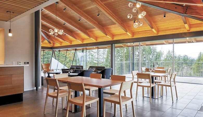 Retractable floor-to-ceiling glass walls allow the outside in at the new REX HILL tasting room and hospitality center in Newberg. The surrounding deck overlooks the vineyard, giving guests even more room to enjoy wine and relax. ##Photo courtesy of REX HILL