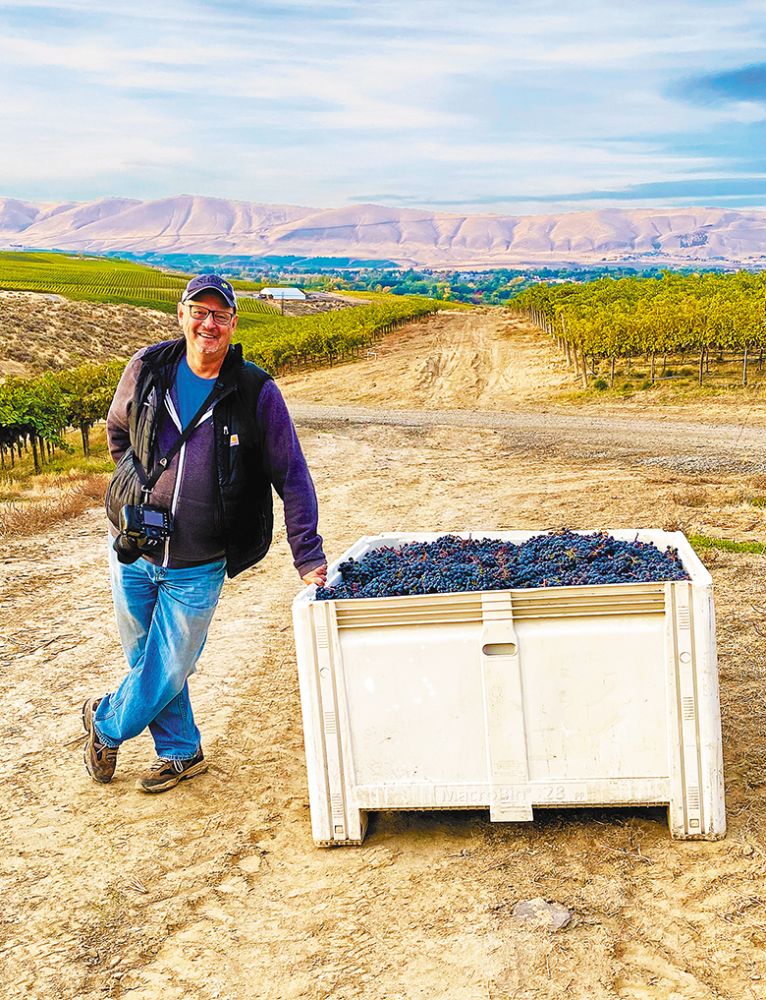 Photographer Richard Duval during grape harvest in Washington. ## Photo By Richard Duval