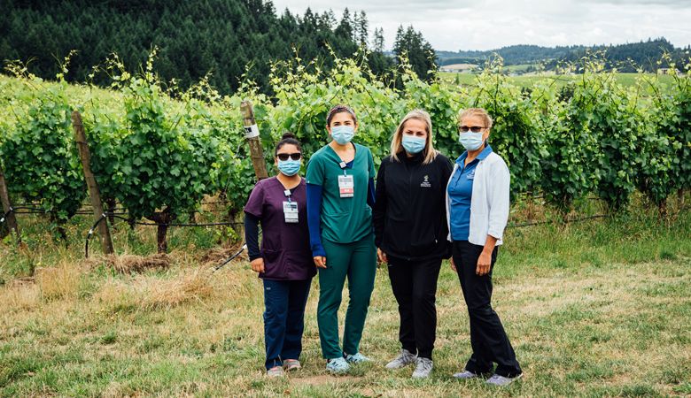 The ¡Salud! clinical outreach team: (from left) Miriam Lopez, program assistant; Erika Sanchez Lerma, R.N., outreach nurse; Andrea Lara Silva, M.P.H., health educator; and Leda Garside, R.N., M.B.A., clinical nurse manager. ##Photo by Kathryn Elsesser