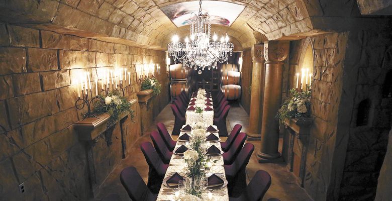 The wine cave at Reustle-Prayer Rock is set for a special SOMM camp dinner. ##Photo by Andrew Calvert