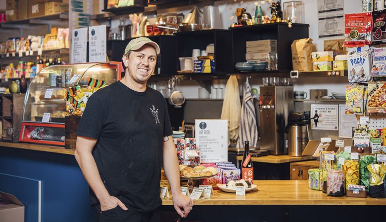 Erik Hanson, saké buyer at Giraffe Goods. Look for a variety of sakés at the Japanese deli and shop located inside Cargo in S.E. Portland. ##Photo by Kathryn Elsesser