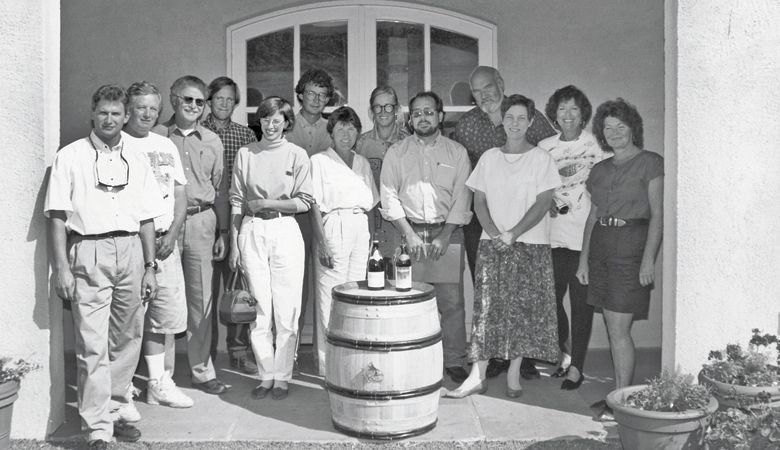 ¡Salud! auction planning group, circa 1992. In the parentheses is the winery/vineyard the person was associated with in 1992. From left: Steve Vuylsteke (Oak Knoll), Peter Adams, (Adams Vineyard Winery), Terry Casteel (Bethel Heights), Russ Raney (Evesham Wood), Mary Raney (Evesham Wood), Bill Hatcher (Domaine Drouhin Oregon), Marilyn Webb (Bethel Heights), Carol Adams (Adams Vineyard Winery), unidentified, Dick Erath (Erath Winery), Diana Lett (The Eyrie Vineyards), Joan Erath (Erath Winery) and Nancy Ponzi (Ponzi Vineyards). ##Photo provided
