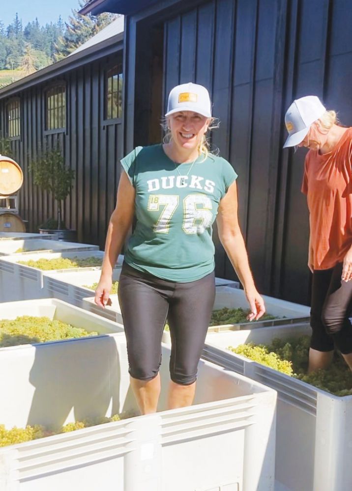 Sarah Murdoch at work stomping grapes.##Photo provided by Hazelfern Cellars Sarah Murdoch at work stomping grapes.##Photo provided by Hazelfern Cellars