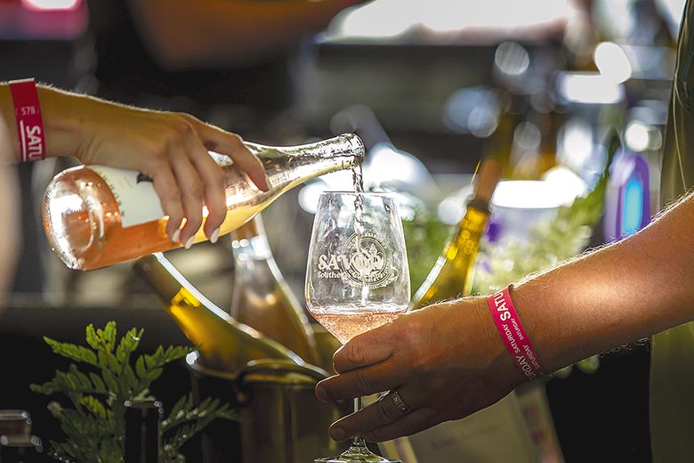 A Rogue Valley winery pouring a sample at Savor Southern Oregon. ## Photo provided by Travel Medford