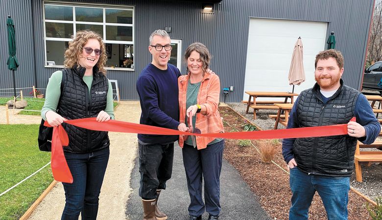 Clea Arthur and Brian Denner cut the ribbon to the couple’s reconstructed facility for Simple Machine Winery. Builders of the project, Kayla Bundy and Brian Gray of The Ashland Group, join in on the celebration. ##Photo provided