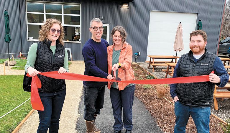 Clea Arthur and Brian Denner cut the ribbon to the couple’s reconstructed facility for Simple Machine Winery. Builders of the project, Kayla Bundy and Brian Gray of The Ashland Group, join in on the celebration. ##Photo provided