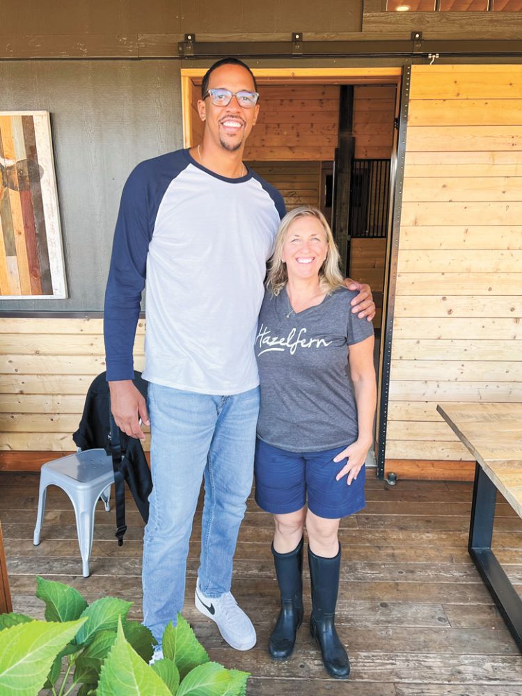 “Small fry” Sarah Murdoch posing with Channing Frye, NBA Champion and founder of Chosen Family Wines. Hazelfern Cellars collaborates on Frye’s Syrah.##Photo by Sarah Murdoch “Small fry” Sarah Murdoch posing with Channing Frye, NBA Champion and founder of Chosen Family Wines. Hazelfern Cellars collaborates on Frye’s Syrah.##Photo by Sarah Murdoch