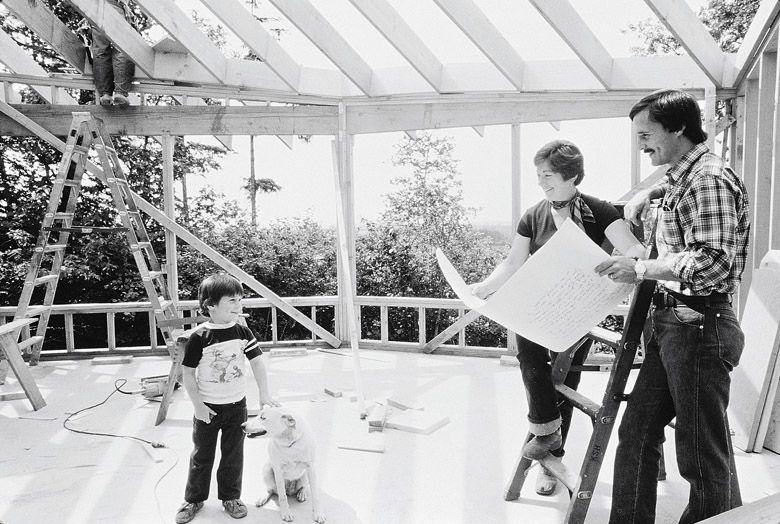 Susan Sokol Blosser and Bill Blosser look over plans during the construction of their new tasting room. Their son, Alex, and the family dog are also present.
(Left to right): Alex Sokol Blosser, Susan Sokol Blosser, Bill Blosser.##Courtesy of Sokol Blosser Winery and Susan Sokol Blosser