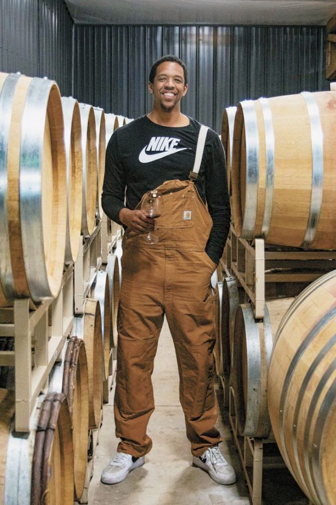 Chosen Family Wines’ Channing Frye standing among barrels in the winery.##Photo provided By Chosen Family Wines