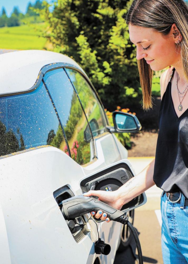 Stoller employee utilizing one of the many charging stations found on the property. ##Photo provided by Stoller Family Estates