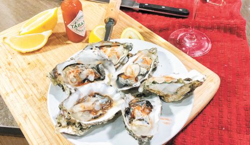 Upper Five Vineyard’s Terry Sullivan celebrates Valentine’s Day with oysters and Underwood Bubbles.##Photo provided by Upper Five Vineyard