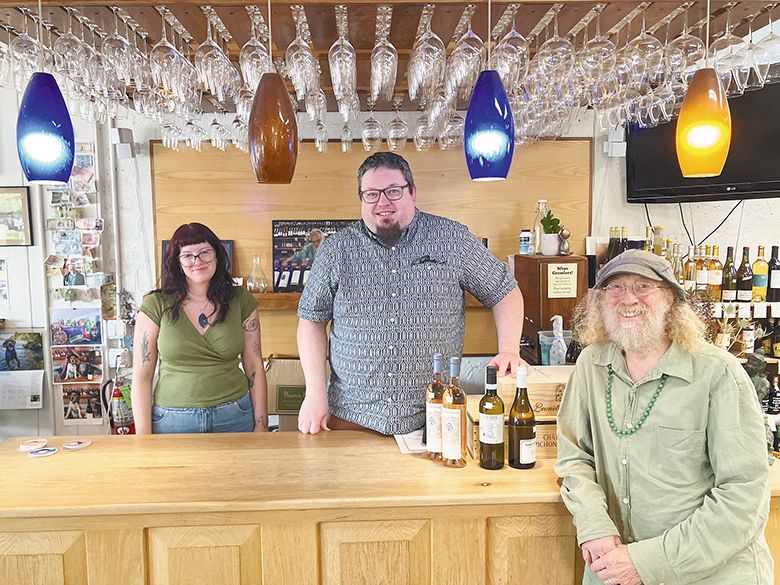 Sundance Wine Cellars&rsquo; employee, Satori Savoie (far left); manager and buyer, Tom DeVaul (center) and information systems manager David Resseguie. ## Photo by Pete Holland
