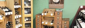 Wines on display beneath a photo of the previous owner Gavin McComas of Sundance Wine Cellars. ## Photo by Pete Holland