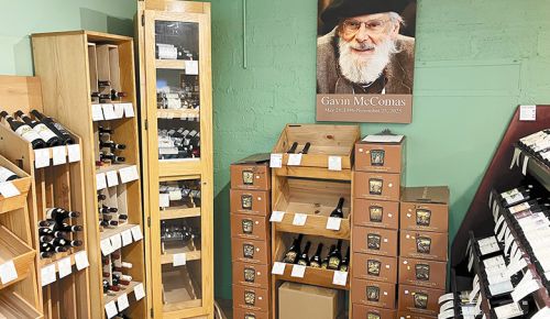 Wines on display beneath a photo of the previous owner Gavin McComas of Sundance Wine Cellars. ## Photo by Pete Holland
