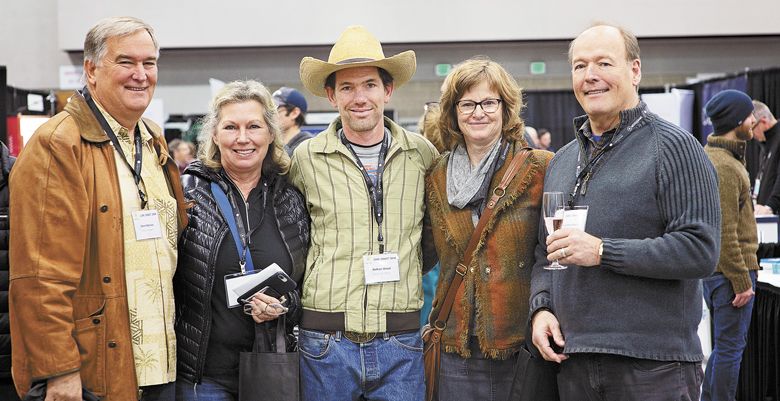 Steve and Leslie Beckley (left) of Knoll Vineyards; Nathan Wood of Elkton Vineyard Management; and Sue and Terry Brandborg of Brandborg Vineyards pause during a tradeshow break. ##Photo by Carolyn Wells-Kramer