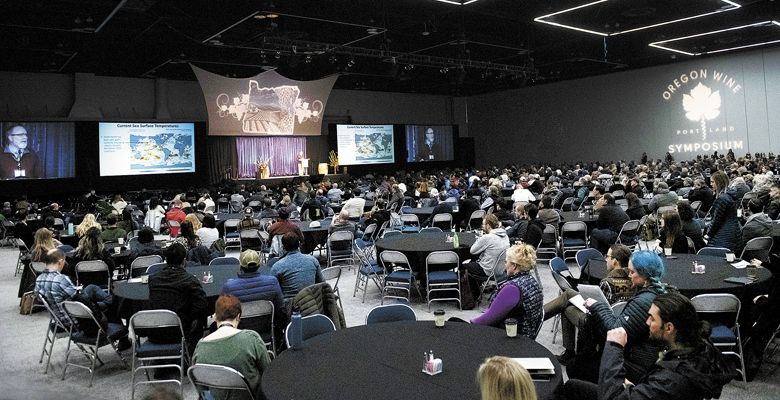 Greg Jones, climatologist and director of Linfield College’s Evenstad Center for Wine Education, presents his annual climatology report to the main exhibit hall on the second day. ##Photo by Carolyn Wells-Kramer