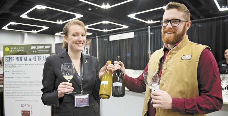 Edgefield Winery assistant winemaker Liz Kelly-Campanale and team member Jon Mantalvo help execute the Experimental Wine Trials seminar. ##Photo by Carolyn Wells-Kramer