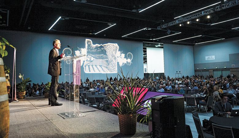 Tom
Danowski, the
executive director
of the Oregon
Wine Board, welcomes
industry
members to the
annual awards
luncheon at the
Oregon Convention
Center. ##Photo by Carolyn Wells-Kramer