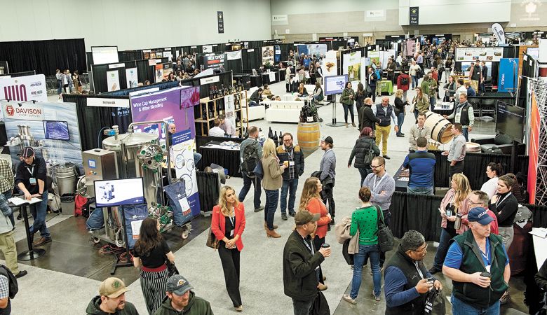 The trade
show buzzes with
activity. ##Photo by Carolyn Wells-Kramer