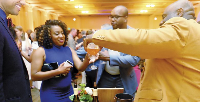 Bertony Faustin of Abbey Creek Vineyard pours his wine for guests attending TASTE PDX at the Portland Art Museum on May 31. ##Photo provided