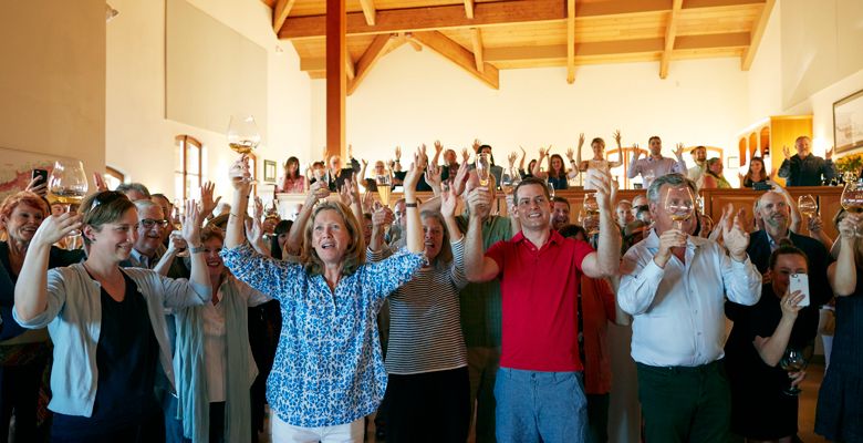 Véronique Drouhin-Boss leads guests in singing “Le Ban Bourguignon,” the official hymn of Burgundian cellars. ##Photo by Serge Chapuis