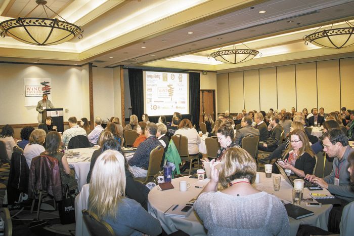 Attendees at the 2013 Wine Tourism Conference, hosted at the DoubleTree near the Lloyd Center in Portland, take notes while speakers offer advice and strategies in regard to wine and culinary tourism. Photo by Andrea Johnson. Attendees at the 2013 Wine Tourism Conference, hosted at the DoubleTree near the Lloyd Center in Portland, take notes while speakers offer advice and strategies in regard to wine and culinary tourism. Photo by Andrea Johnson.