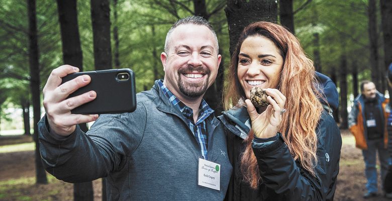 A couple takes a selfie with their big score unearthed during an expert-led hunting excursion. ##Photo by Kathryn Elsesser