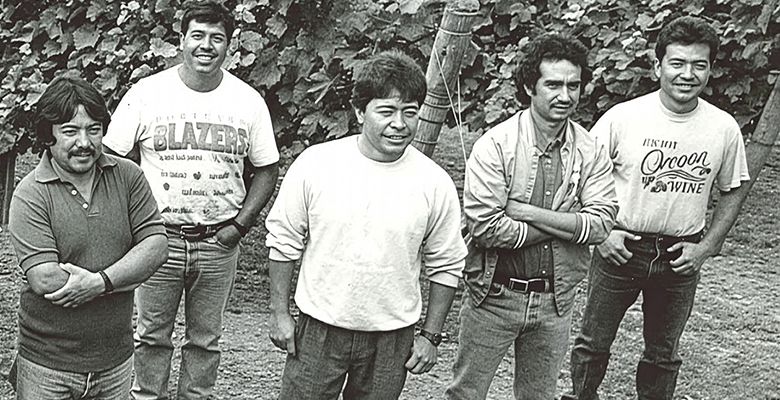 The original Tualatin Estate Vineyard and Winery crew, taken in 1980. Miguel Loeza, Willamette Valley Vineyards  current vineyard foreman, is standing in the center. Efren Loeza, Willamette Valley Vineyards  current vineyard manager, is on the far right. ## Photo provided by Willamette Valley Vineyards