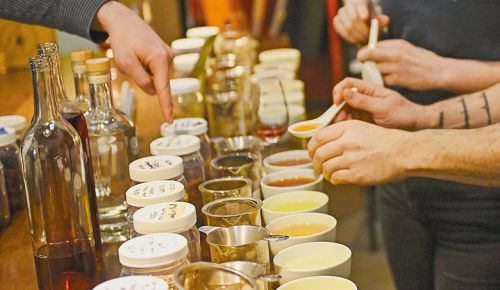Individual botanicals, steeped in boiling water, are considered for this year’s Summer Vermouth, 
a collobration between Son of Man Cidery and Someday Bar. ## Photo by Carolyn Wells-Kramer