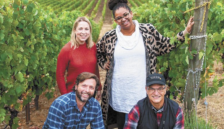 Vidon Vineyard owners Erin (standing left) and Dru Allen (kneeling left), Tiquette Bramlett, Vidon president (standing right), and David Bellows, Vidon winemaker (kneeling right). ##Photo provided