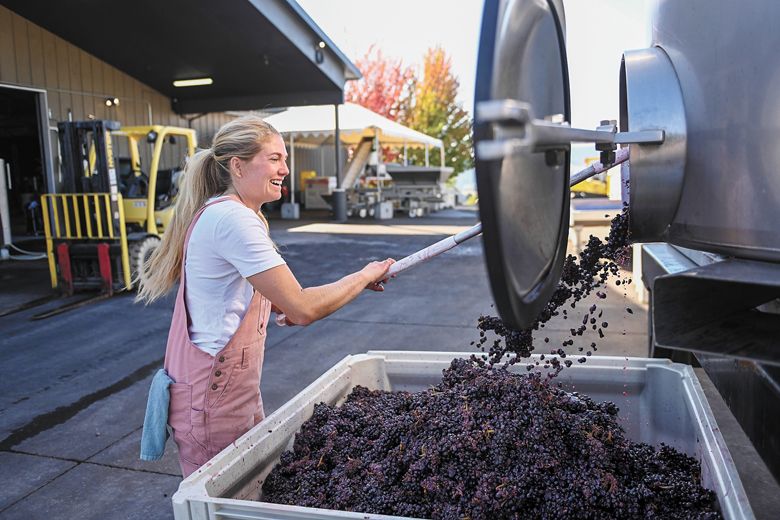 Bergström Wines  winemaker, Madeline Rausch, emptying a tank.