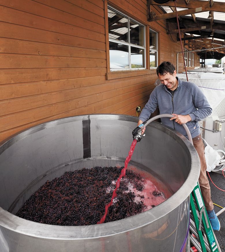 Anthony King, general manager at The Carlton Winemakers Studio is all smiles as he works.