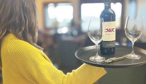 A student serving a bottle of College Cellars wine. ## Photo provided by Walla Walla Community College