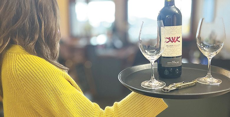 A student serving a bottle of College Cellars wine. ## Photo provided by Walla Walla Community College