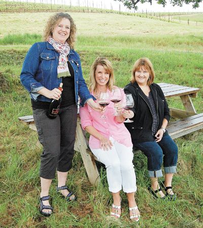 From left: Rebecca Moore, WWS national president; Amber Yates, head of Central Oregon WWS; and Larlene Dunsmuir, head of Portland WWS, toast WWS at Monks Gate
Vineyard, Moore’s parents’ venture outside of Carlton in the Willamette Valley. Photo by Hilary Berg