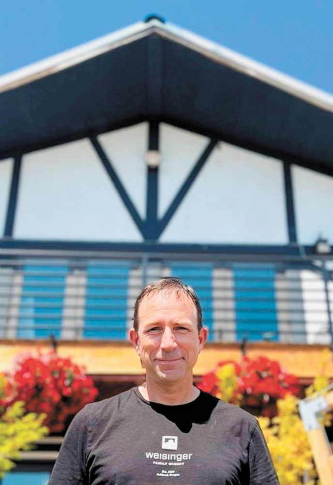 Second-generation winemaker Eric Weisinger, standing in front of Weisinger Family Vineyard.##Photo provided by Weisinger Family Winery