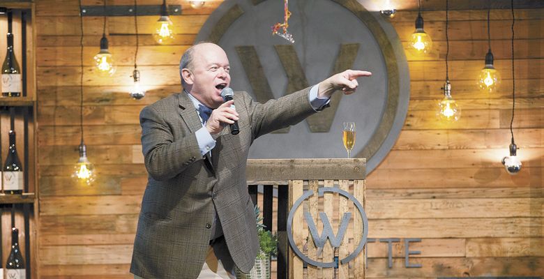 Auctioneer Fritz Hatton playfully prods the audience for higher bids at this year’s Willamette: The Pinot Noir Auction. ##Photo by John Valls