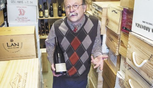 Tom Reider, longtime wine manager at Wizer’s in downtown Lake Oswego, stands among the market’s international cellar located in the basement.