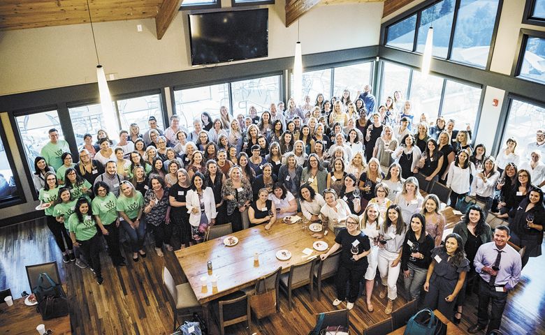 Women in Wine: Fermenting Change seminar. Guests, workers and speakers pause for a group shot inside Willamette Valley Vineyards’ tasting room. ##Photo by Kathryn Elsesser